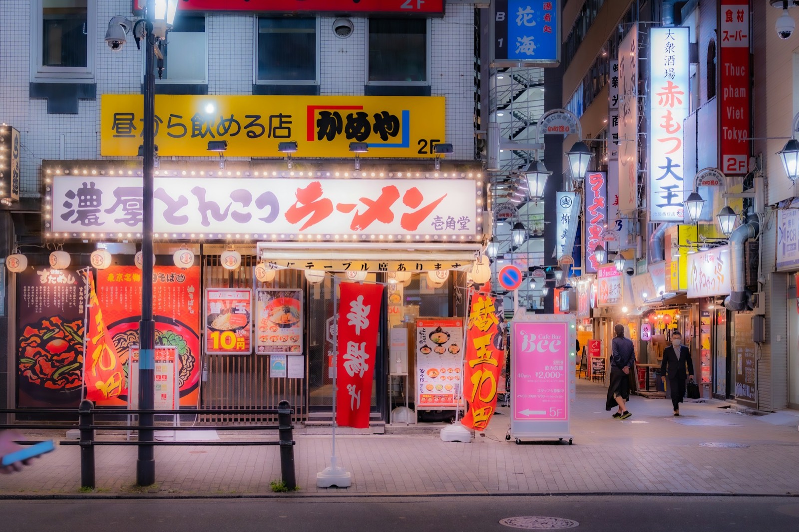 Neon-lit Tokyo street at night