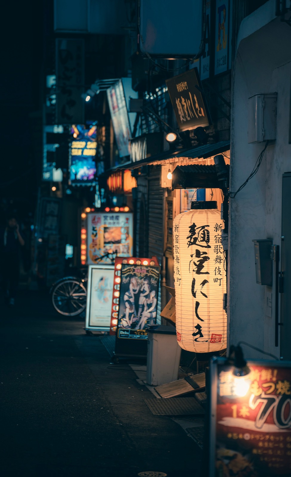 A street stacked with signage, shot tall