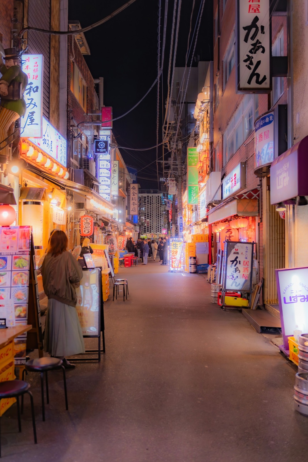 Japanese street at night, lanterns overhead