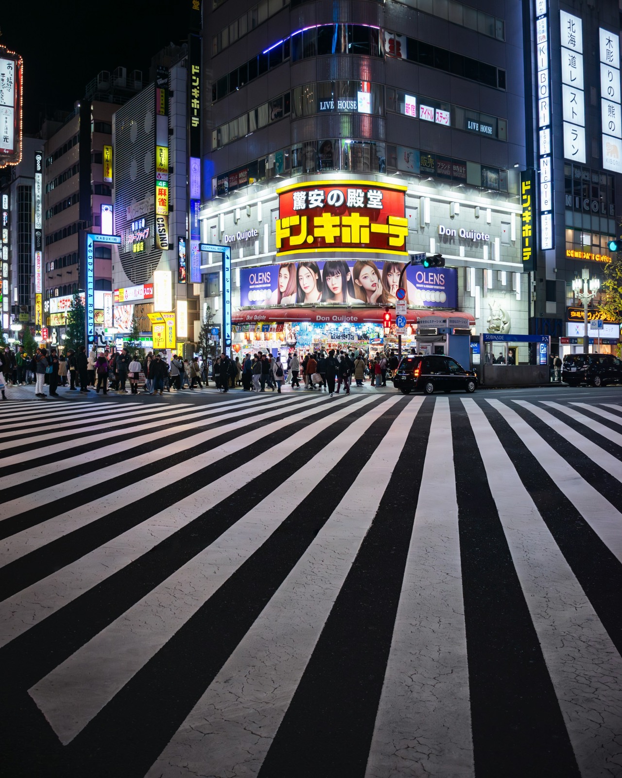 City street at night, crowd in motion