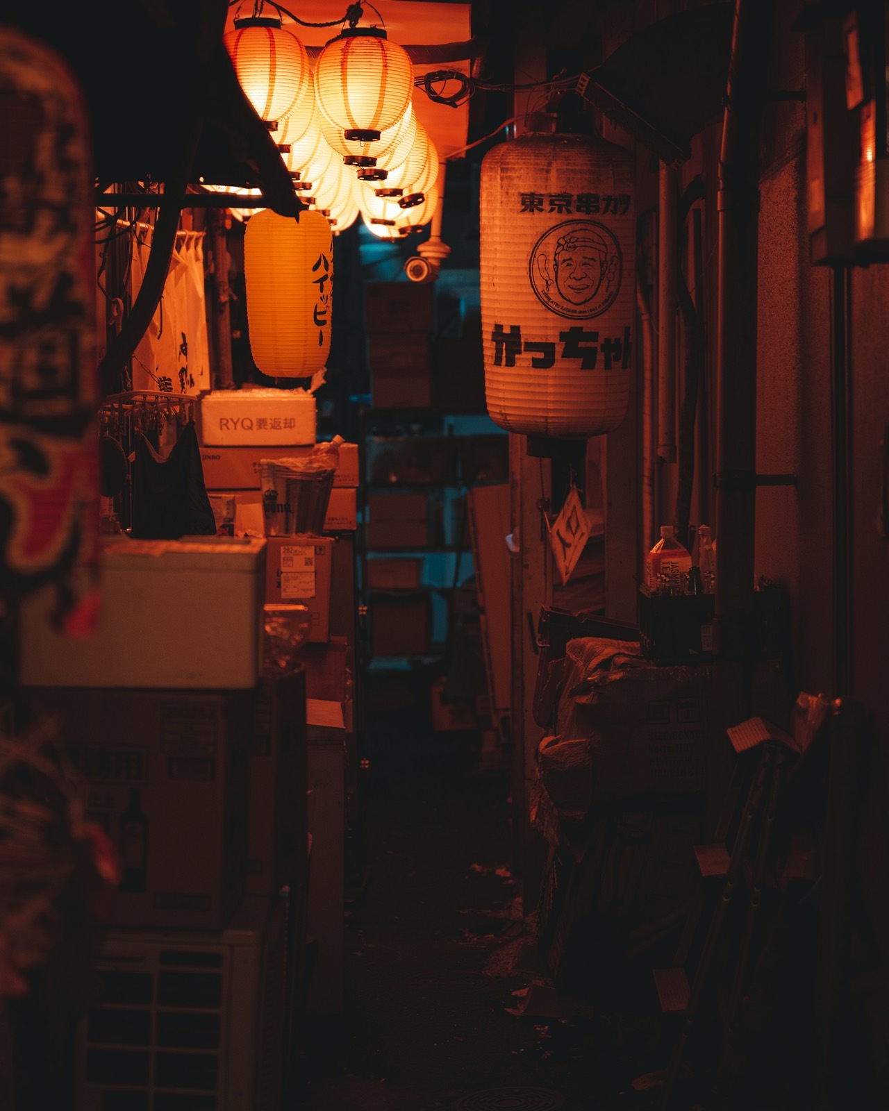 Lanterns strung the length of a dark alley